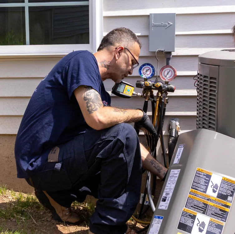 A Sila technician performing AC Maintenance